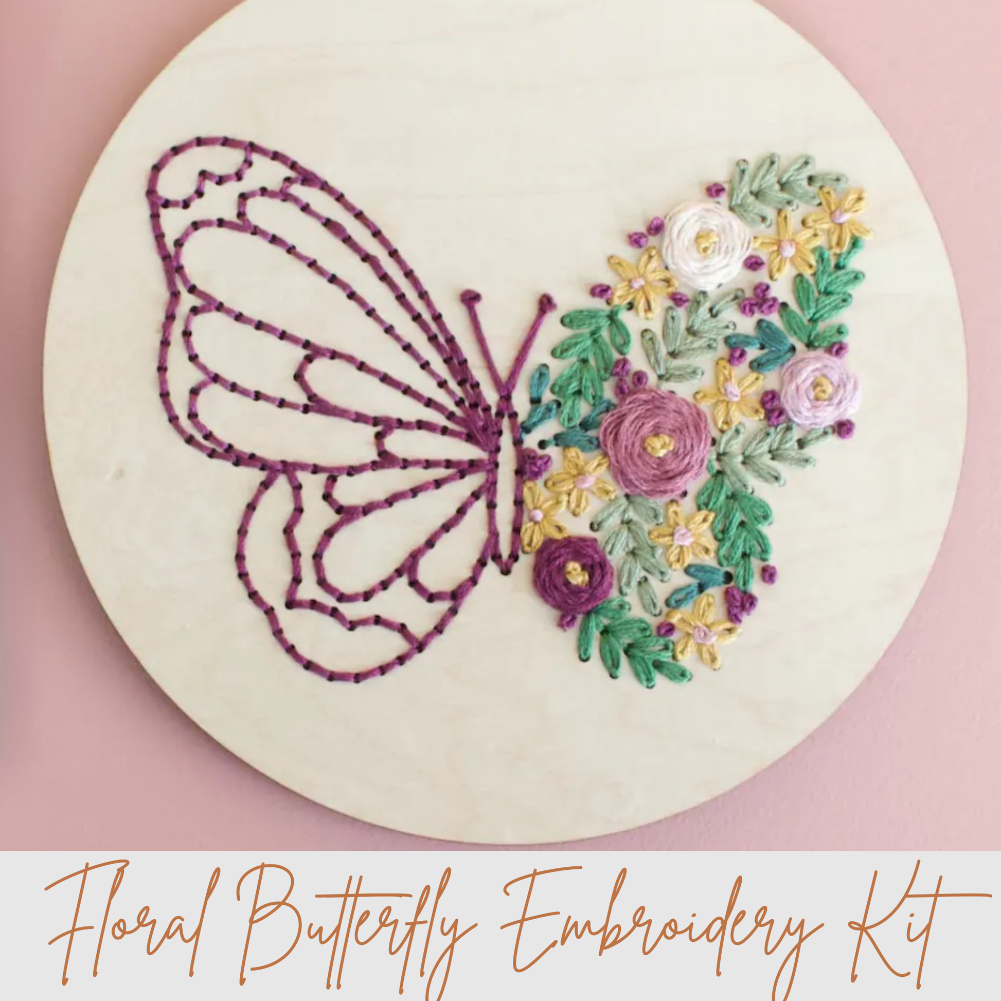 Embroidery hoop with a floral butterfly design on a pink background