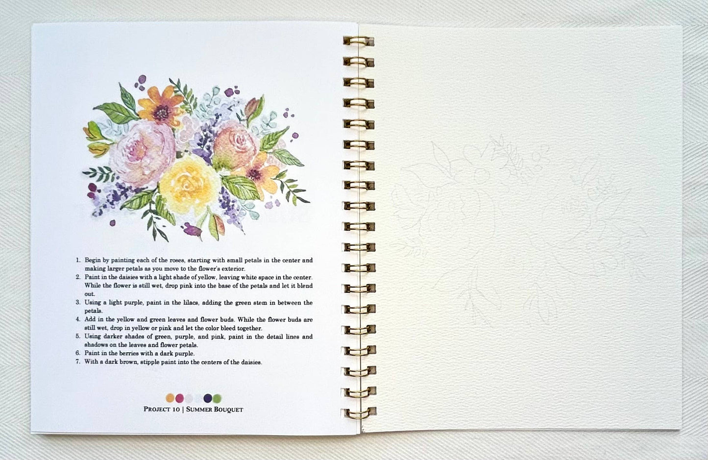 Open notebook with floral illustration and text on a white background