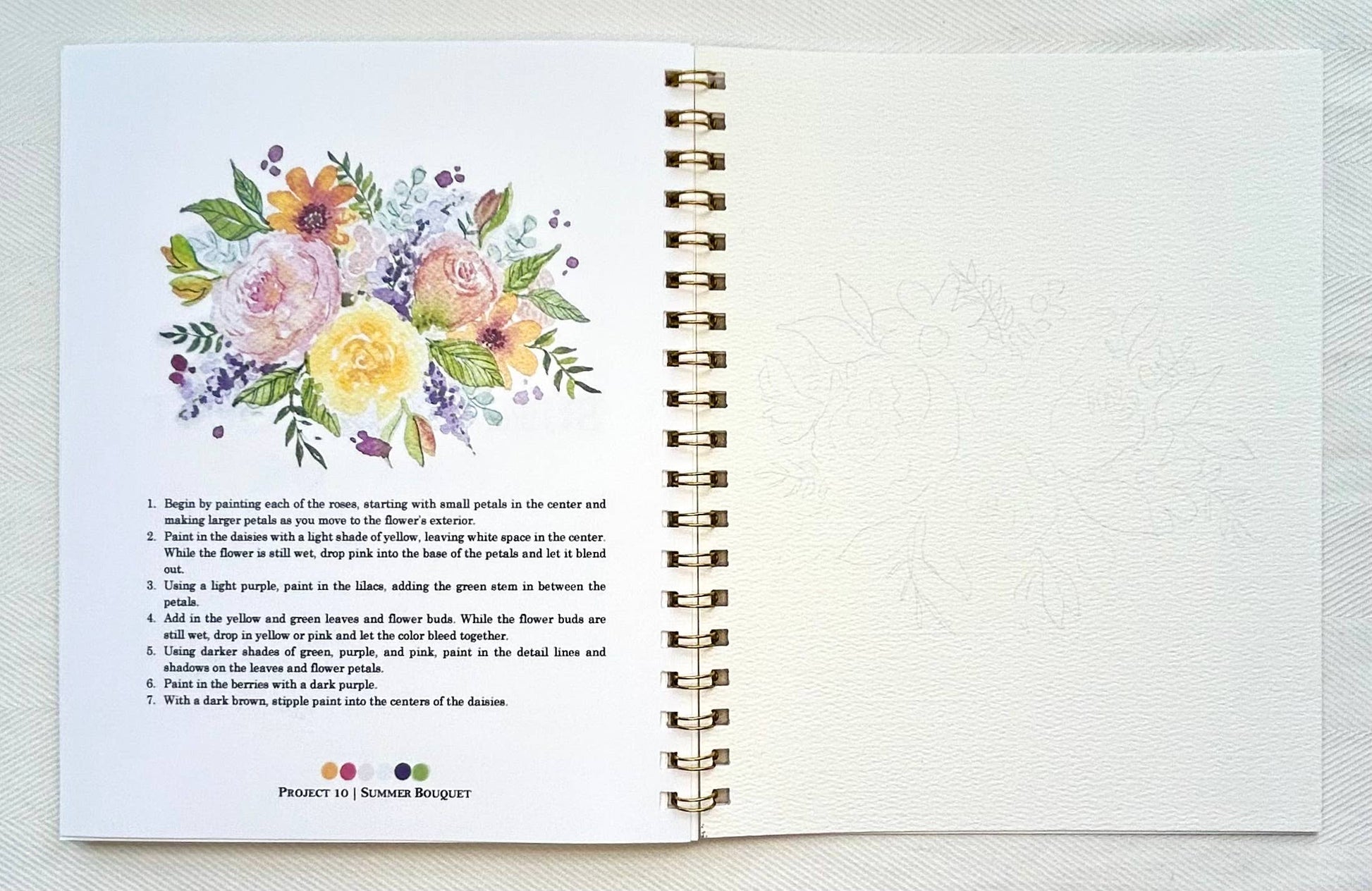 Open notebook with floral illustration and text on a white background