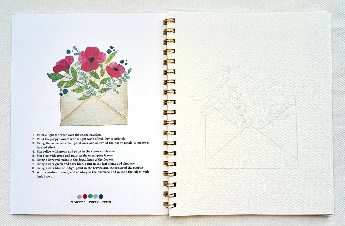 Spiral-bound notebook with a floral design and text on a white background