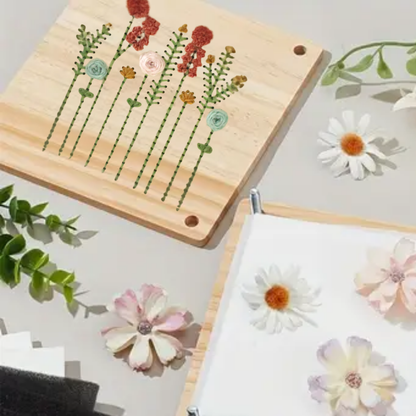 Wooden board with floral designs on a light gray surface