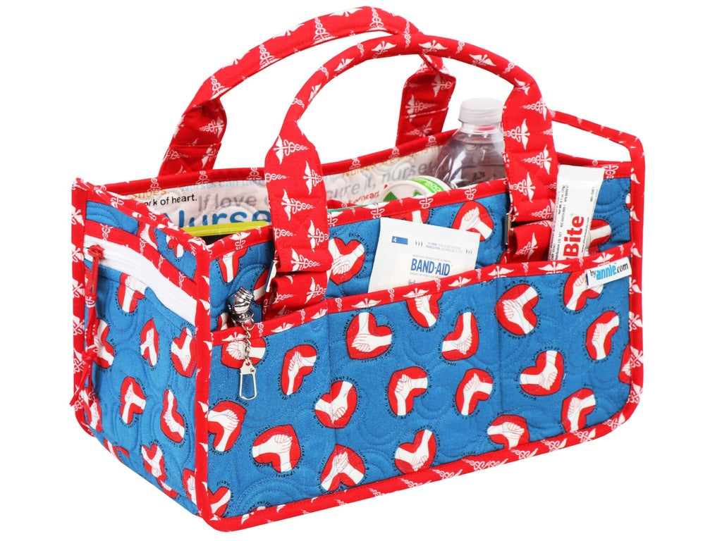 Red, white, and blue caddy bag with medical supplies on a white background