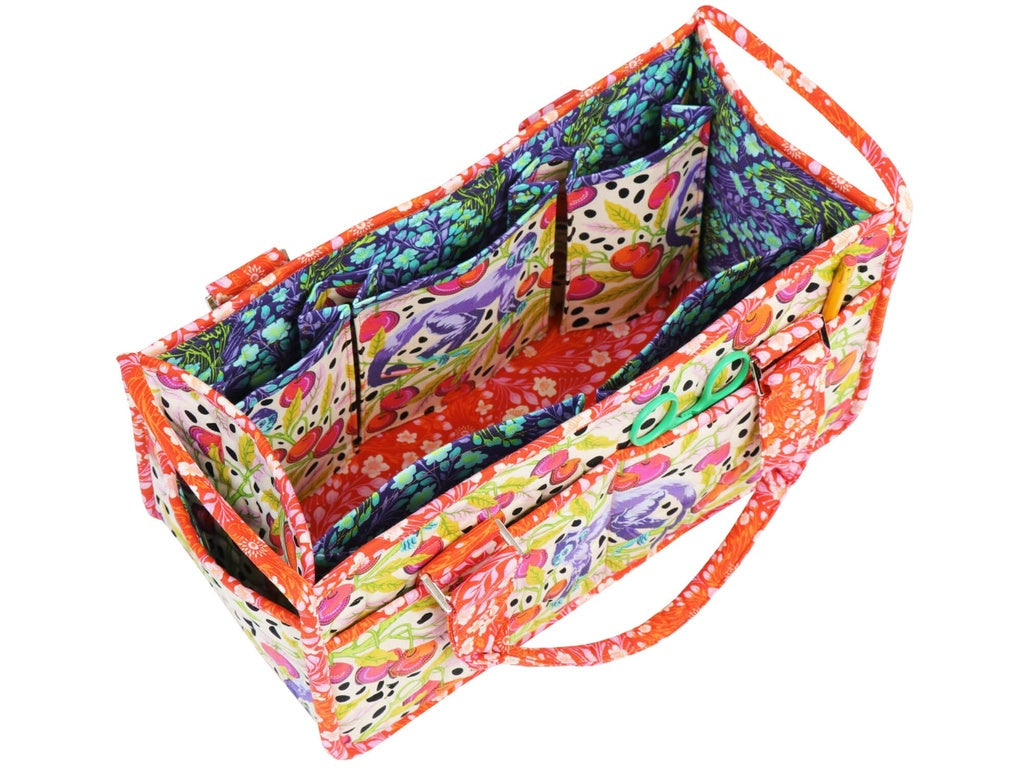 Colorful fabric organizer with floral patterns on a white background