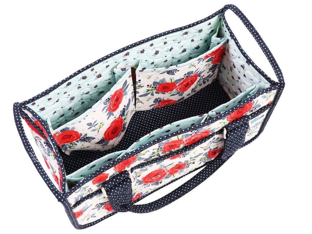 Floral patterned fabric organizer with navy border on a white background