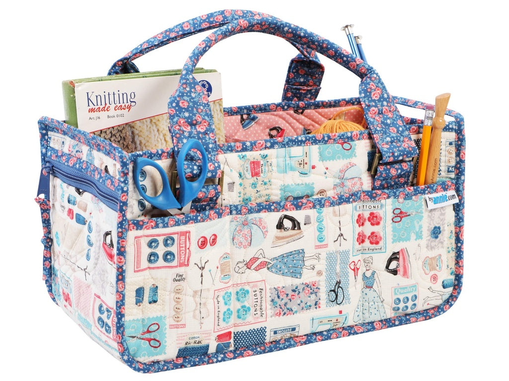 Multifunctional bag with compartments for knitting supplies on a white background