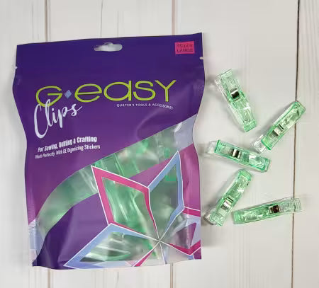 G-easy Clips packaging with green clips on a white wooden surface
