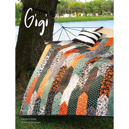 Colorful quilt draped over a tree with a hammock in the background, featuring the brand 'Gigi'.