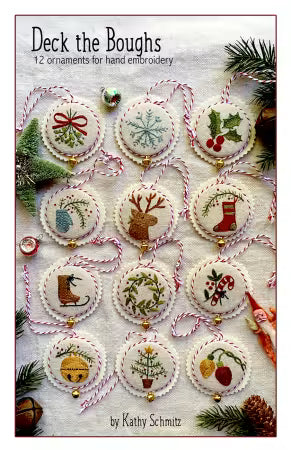 Book cover of 'Deck the Boughs' with embroidered Christmas ornaments.