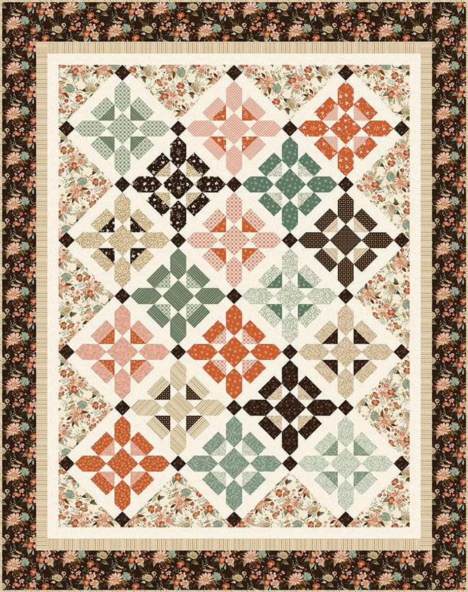 Quilt with geometric pattern and floral border using Riley Blake's Morning Latte Collection