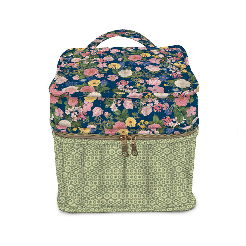 Floral-patterned fabric box with a green geometric pattern on a white background
