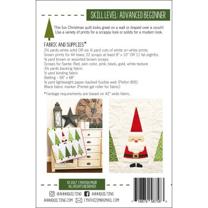 Quilt pattern packaging with Santa Claus design and fabric requirements.