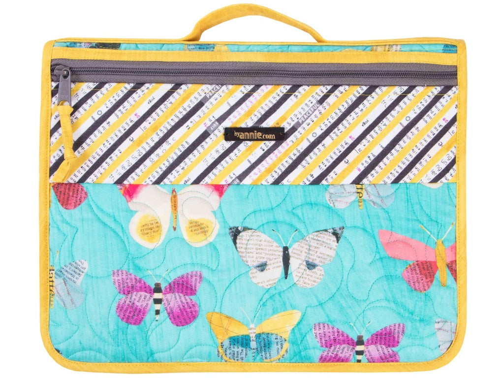 Colorful butterfly-patterned pouch with a striped design on a white background