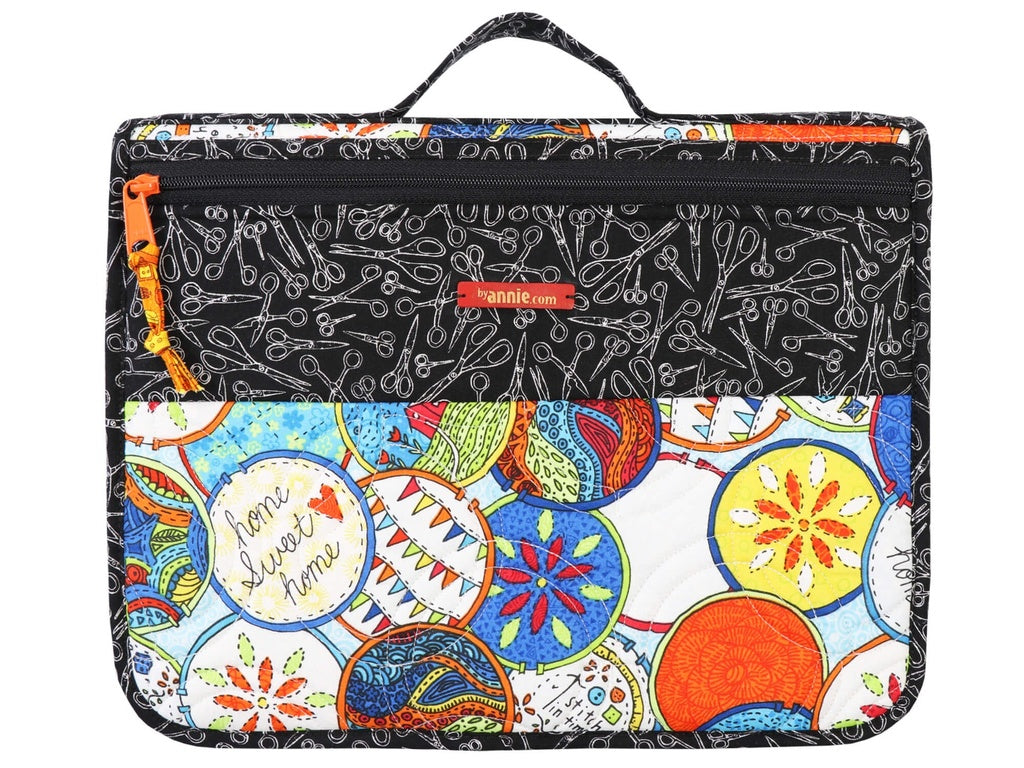 Multicolored fabric pouch with patterned design on a white background