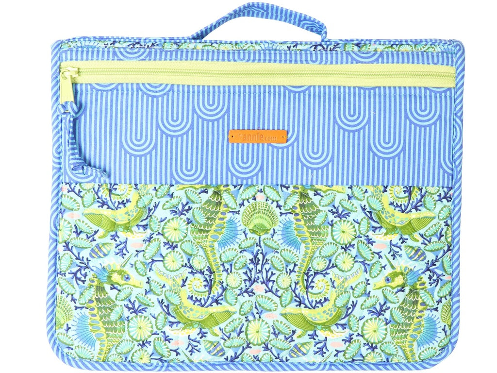 Blue pouch with seahorse pattern on a white background