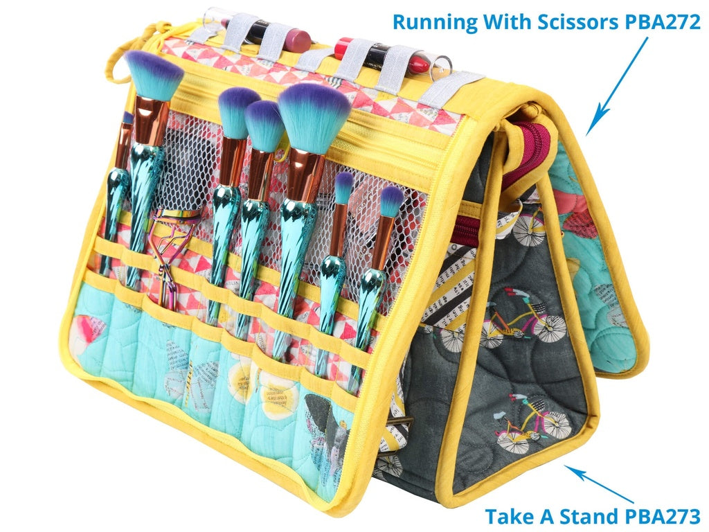 Makeup brush set in a colorful holder with branding text.