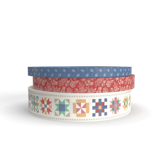 Three rolls of decorative tape with different patterns on a white background