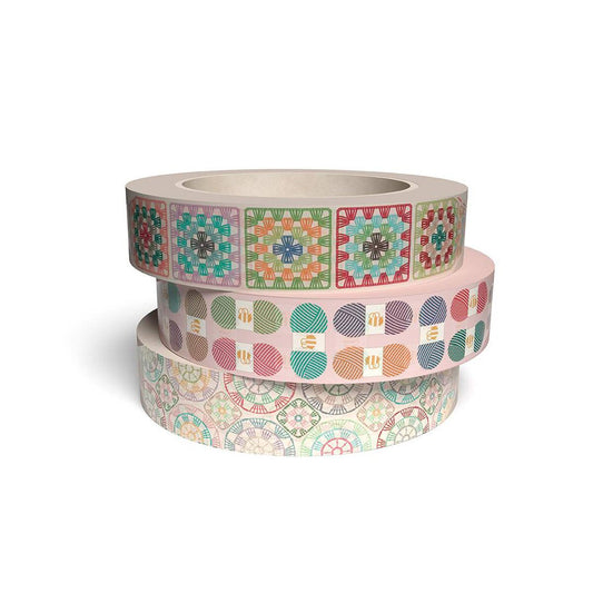 Three rolls of decorative tape with colorful patterns on a white background