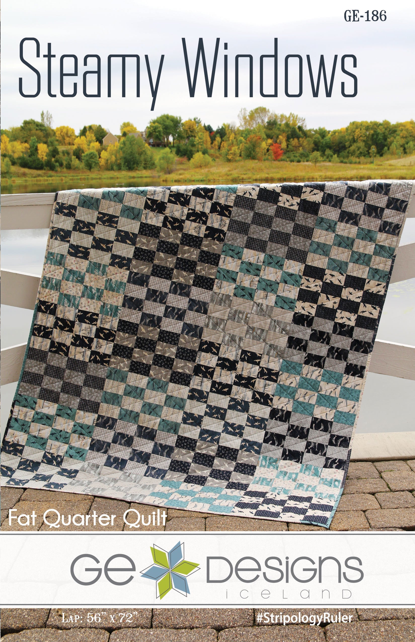 Quilt pattern cover titled 'Steamy Windows' by GE Designs with a checkered quilt on a wooden surface.