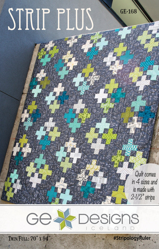 Quilt with cross pattern on a blue background, featuring GE Designs branding.