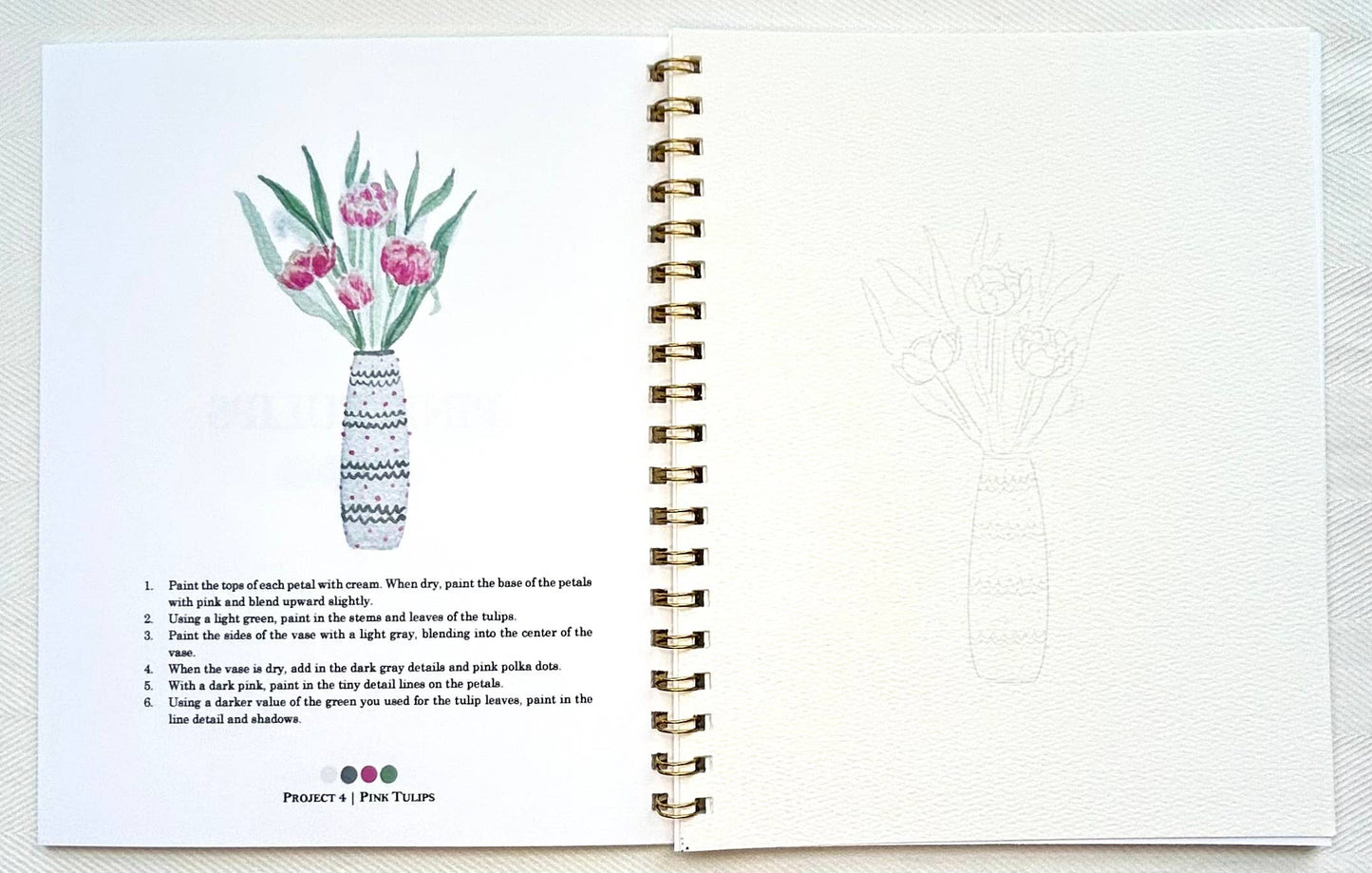 Spiral-bound notebook with a floral illustration on a white background