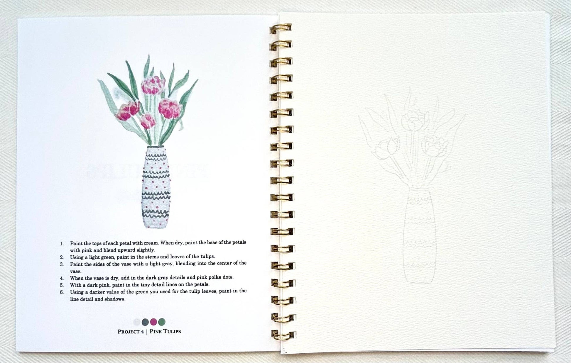 Spiral-bound notebook with a floral illustration on a white background