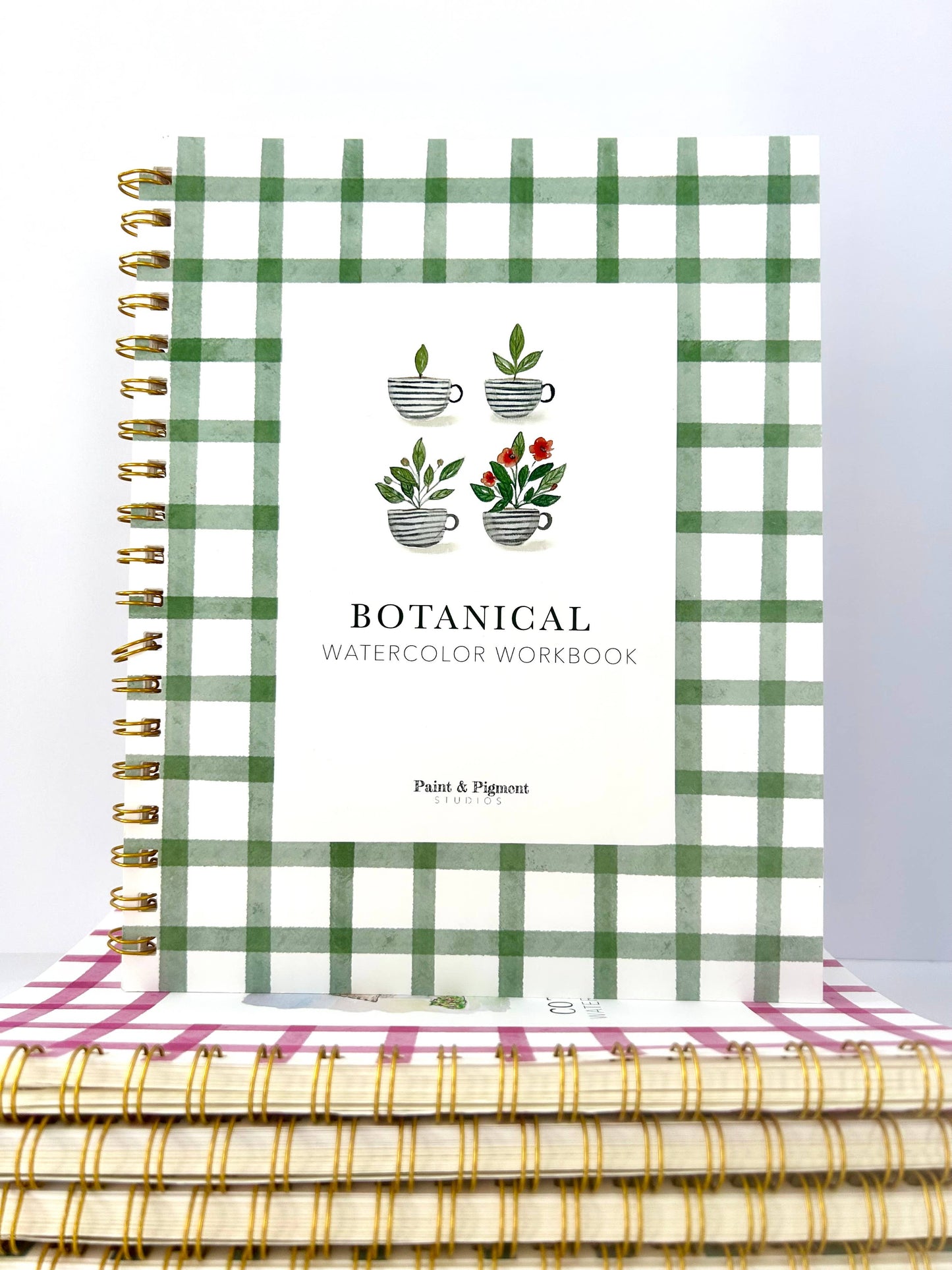 Botanical watercolor workbook with green plaid design on a white background