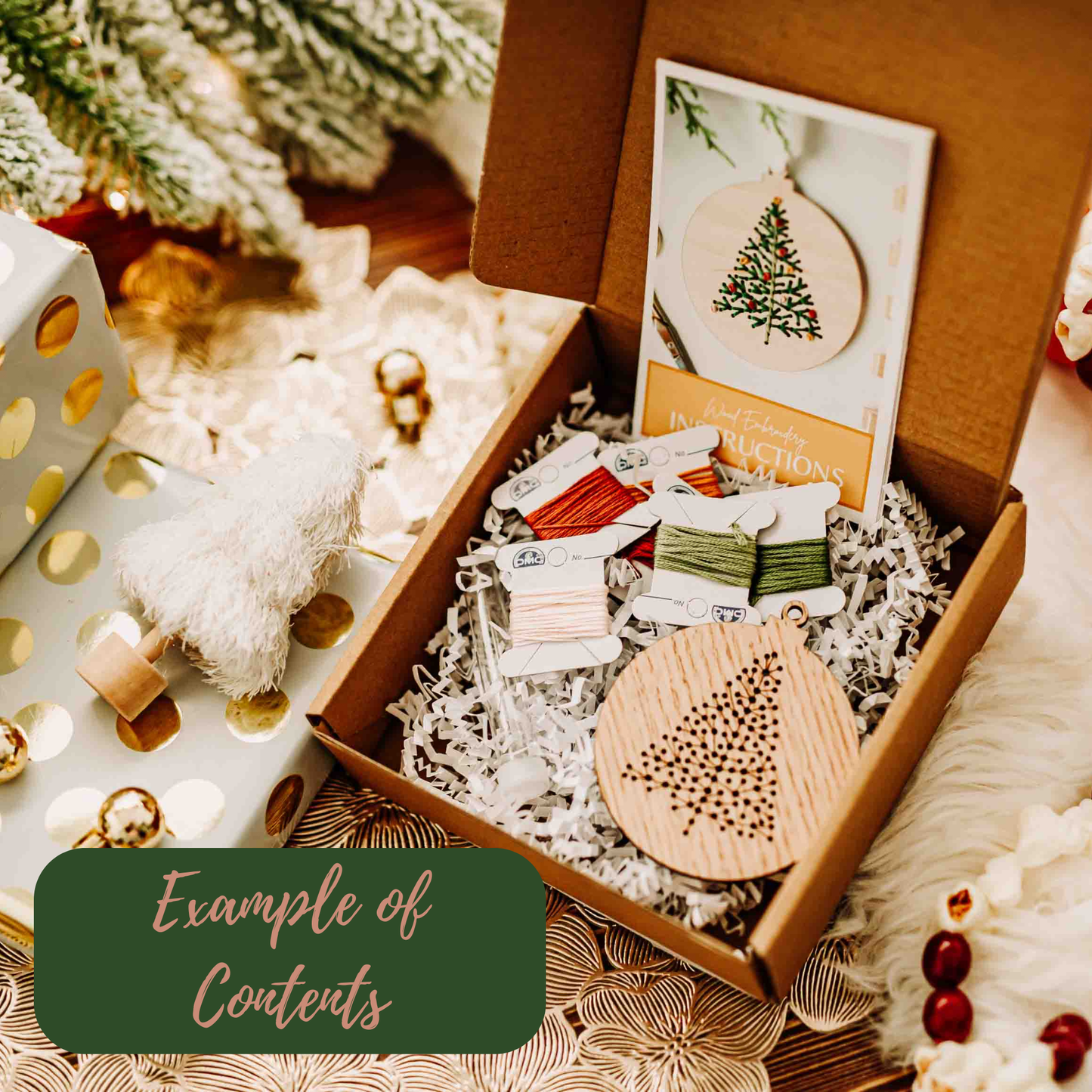 Wooden ornament kit with instructions and materials in a box, surrounded by Christmas decorations.