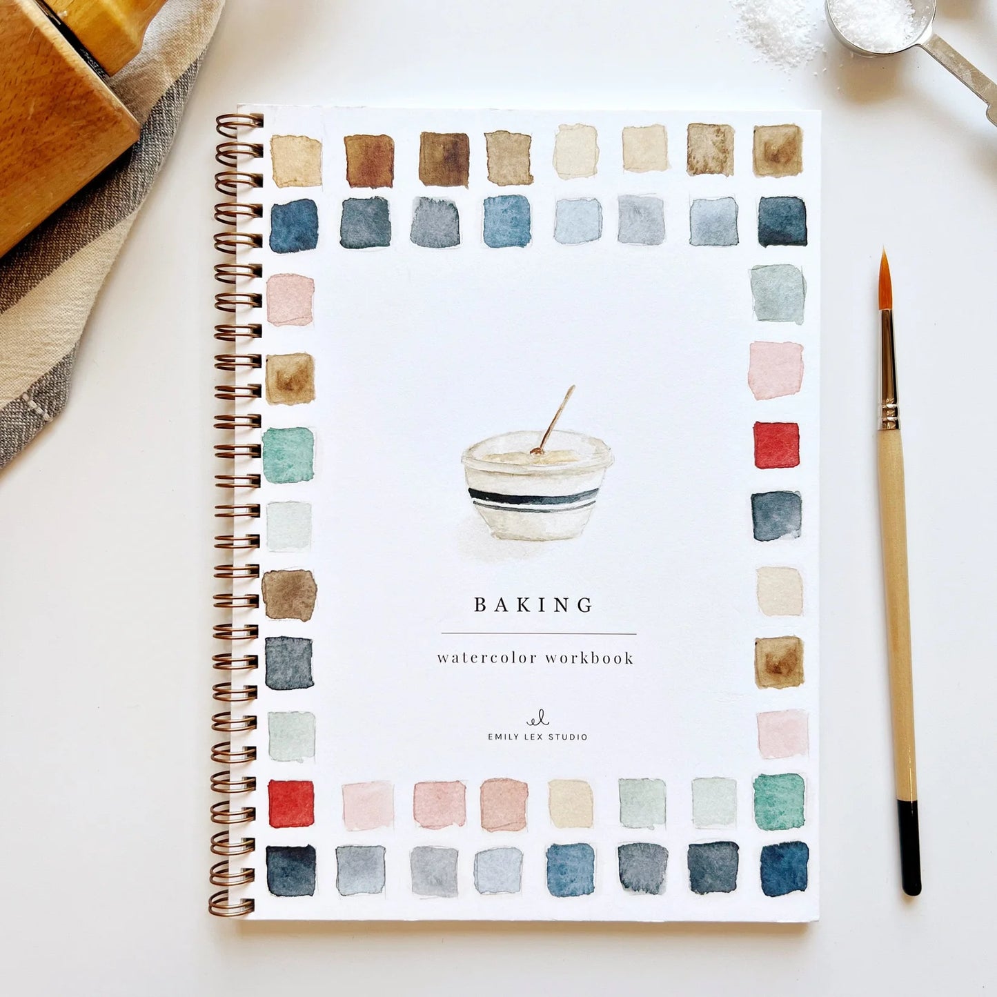 Watercolor workbook titled 'Baking' with color swatches on a white surface.