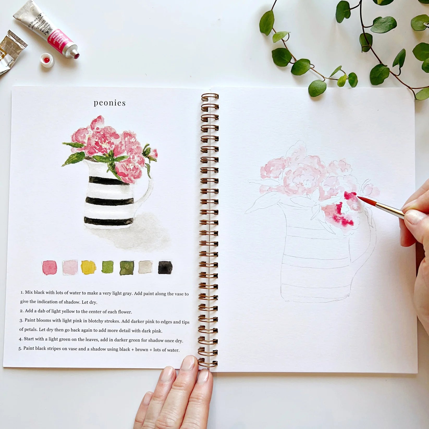 Hand paining Peonies on a jar