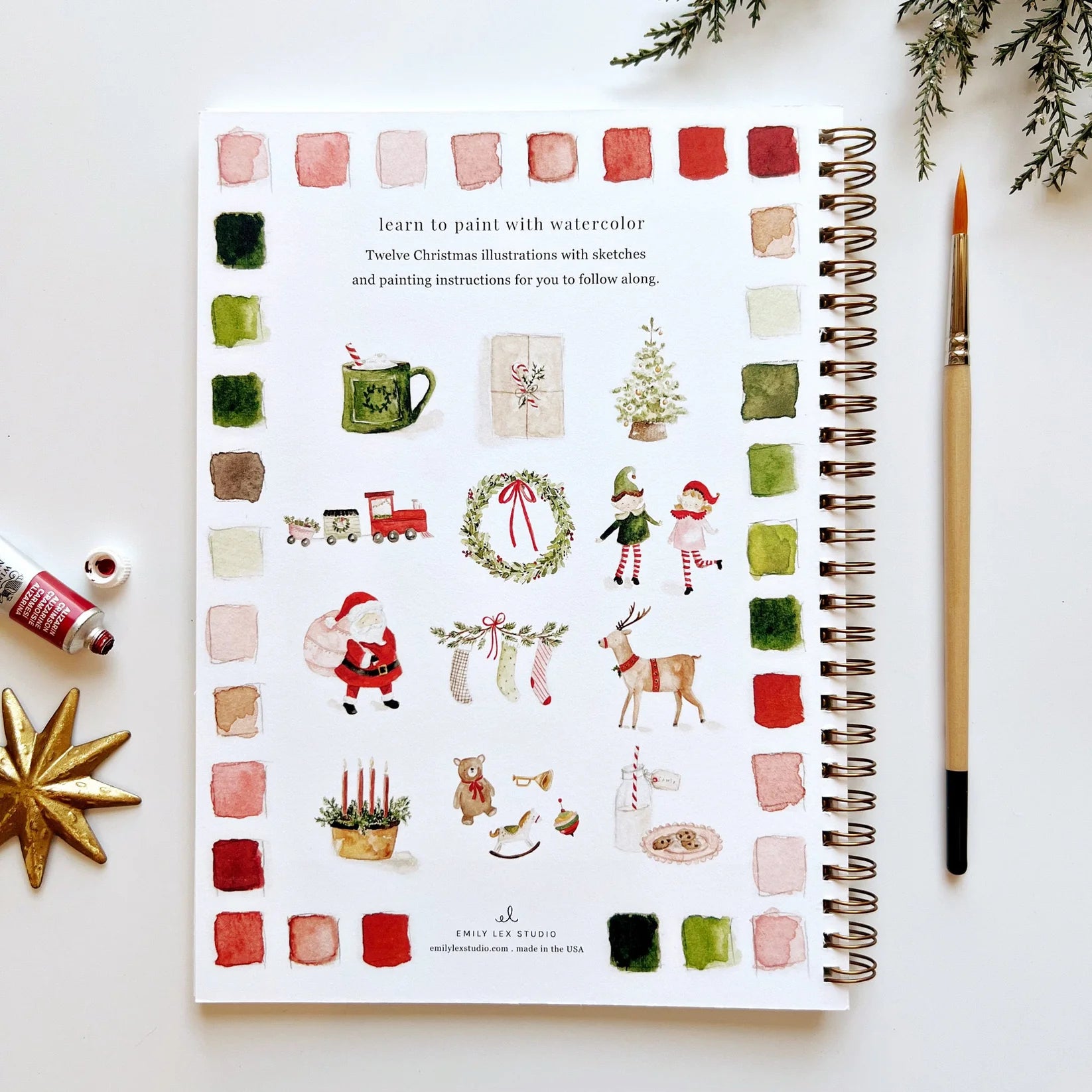 Illustrated Christmas-themed page from a book with watercolor illustrations on a white surface.